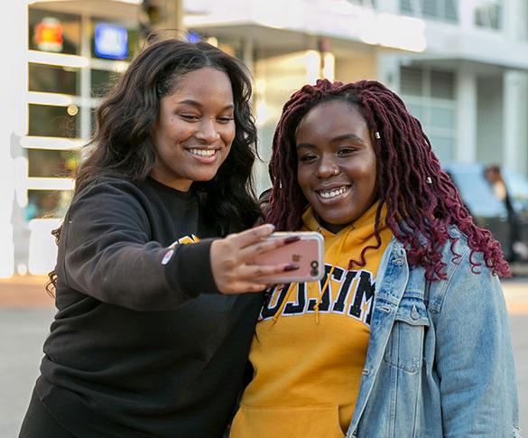 Two women taking a selfie in downtown Columbia